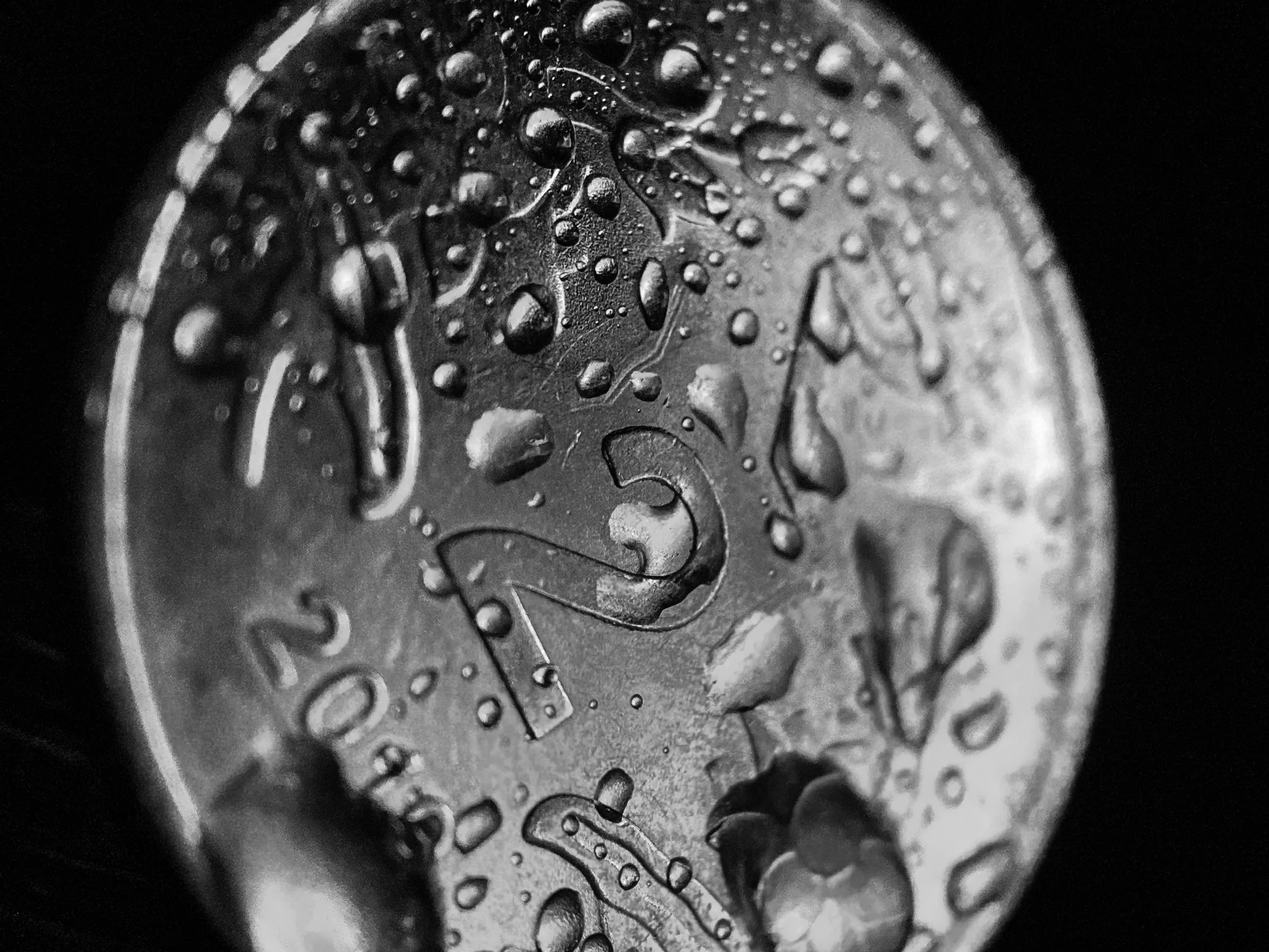 Indian 2-Rupee coin splashed with water